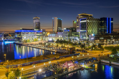 The office blocks and TV studios of MediacityUK at night at Salford Quays. Poster Print by Loop Images Ltd. (17 x 11)
