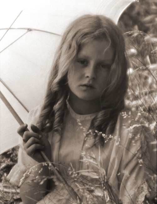 Portrait of a young girl under an umbrella, Victorian or Edwardian era Poster Print by John Short (14 x 18)