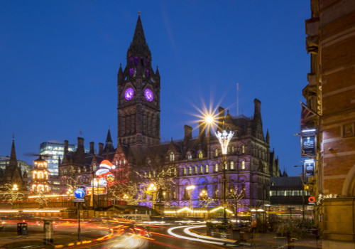 The Christmas markets and Manchester Town Hall at night. Poster Print by Loop Images Ltd. (17 x 12)