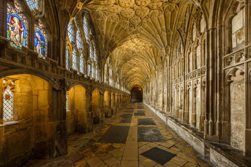 Gloucester Cathedral Cloisters have wonderful fan vaulted ceilings dating from the 14th Century. Poster Print by Loop Images Ltd. (19 x 13)