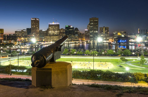 Baltimore city skyline and harbour at night from Federal Hill Park. Poster Print by Loop Images Ltd. (19 x 13)