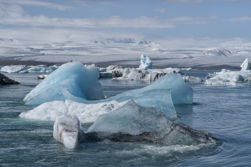 Icebergs floating in the glacial lagoons of southern Iceland; Iceland Poster Print by Robert Postma (18 x 12)