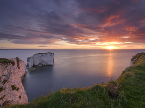 Sunrise at Old Harry Rocks. Poster Print by Loop Images Ltd. (18 x 14)