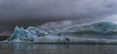 Icebergs floating in the glacial lagoons of southern Iceland; Iceland Poster Print by Robert Postma (26 x 12)