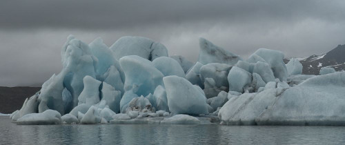 Icebergs floating in the glacial lagoons of southern Iceland; Iceland Poster Print by Robert Postma (24 x 10)