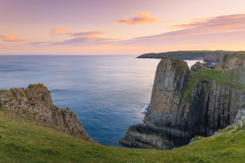 Lydstep nr Tenby at sunset. Poster Print by Loop Images Ltd. (18 x 12)