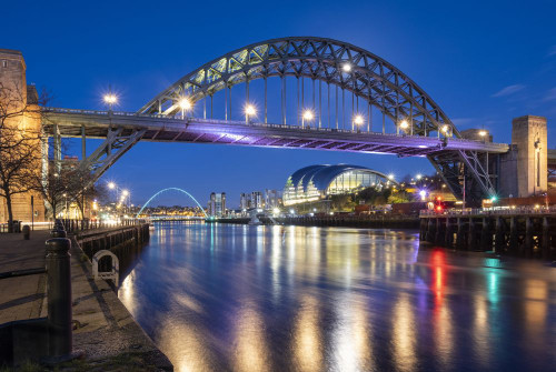 The Tyne Bridge with  Sage Centre and Millennium Bridge over the River Tyne at night. Poster Print by Loop Images Ltd. (19 x 13)