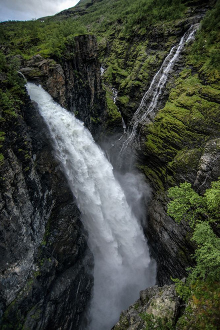 A view of Gorzi waterfall from the bridge spanning Gorsa Canyon in Lyngenfjord in Norway Poster Print by Loop Images Ltd. (13 x 20)
