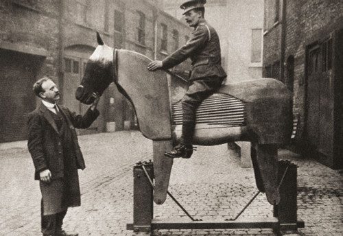 Training raw recruits the rudiments of riding on dummy horses at the start of WWI in 1914. From The Pageant of the Century, published 1934. Poster Print by Ken Welsh (17 x 11)
