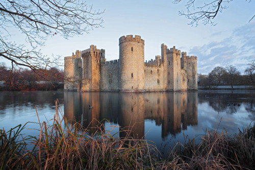 A view of Bodiam Castle with reflection in the water. Poster Print by Loop Images Ltd. (18 x 12)