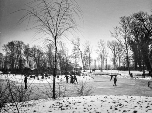 Magic lantern slide circa 1900.Victorian/Edwardian.Social History. People ice skating onthe park pond early 1900 Poster Print by John Short (18 x 13)