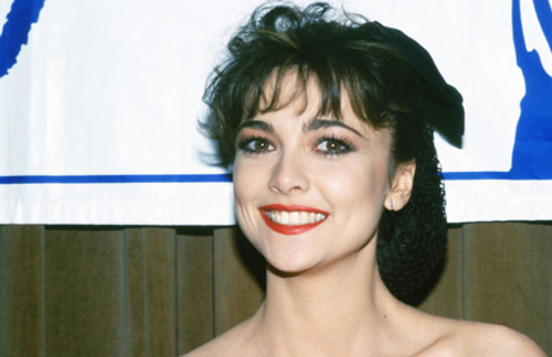 Actress Emma Samms wearing a red dress at Starlight Childrens Foundation formal event and fund raiser, 1983. Photo: Oscar Abolafia (emmasamms003) Poster