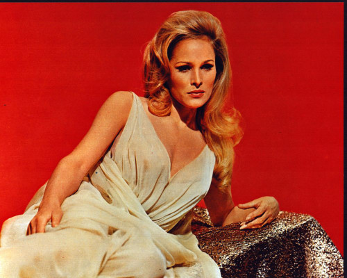 Ursula Andress Laying In White Dress In She Photo Print (8 x 10)
