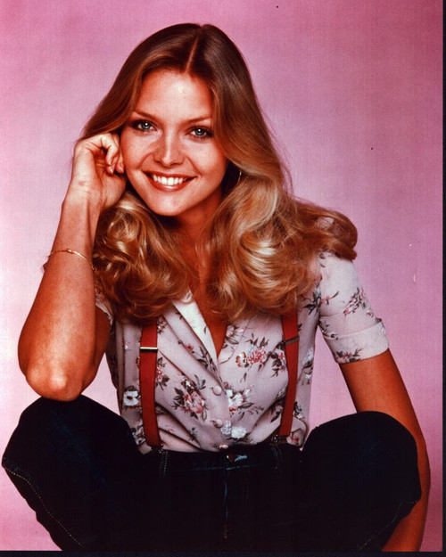 Michelle Pfeiffer Sitting In Floral Top With Suspenders Photo Print (8 x 10)
