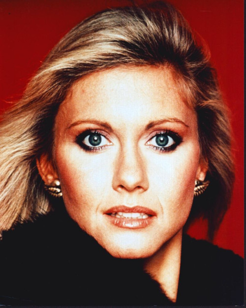 Olivia Newton-John Close Up Red Background Photo Print (8 x 10)