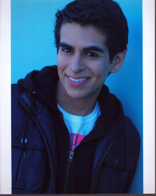 James Cavlo Leaning On Blue Wall In Black Jacket Photo Print