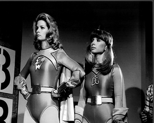 Deidre Hall And Judy Strangis In Costume On Set Of  Electra Woman And Dyna Girl Black And White Photo Print (8 x 10)