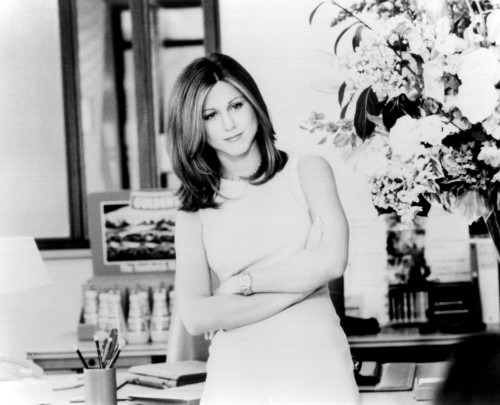 Jennifer Aniston Arms Crossed Next To Flowers In Picture Perfect Black And White Photo Print (8 x 10)