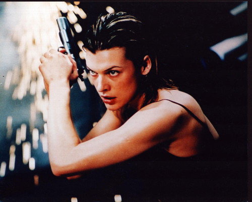 Milla Jovovich Holding Gun N Front Of Sparks In Resident Evil Photo Print (8 x 10)