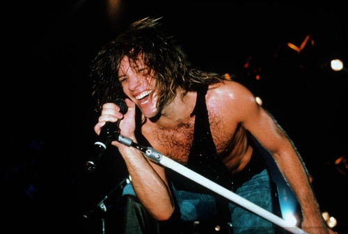 Jon Bon Jovi performing with Bon Jovi in concert, 1980's. ph: Ron Wolfson / (Bon Jovi 10) Poster