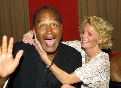 EXCLUSIVE. Miami Beach, FL 2-7-02. OJ Simpson and friend Tammy Wu enjoy a night out at KISS Restaurant. Photo by Adam Scull (OJ_Tammy_5503) Poster