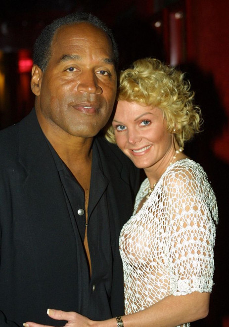 EXCLUSIVE. Miami Beach, FL 2-7-02. OJ Simpson and friend Tammy Wu enjoy a night out at KISS Restaurant. Photo by Adam Scull (OJ_Tammy_5536) Poster