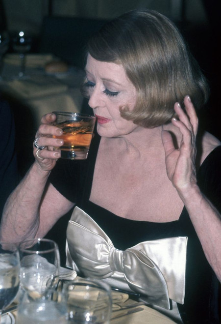 Bette Davis at an event, circa 1970s. Photo: Oscar Abolafia (BETTYDAVIS4) Poster