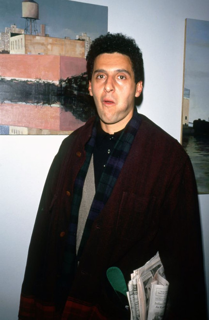 American actor and film maker John Turturro, carrying a newspaper at The Normal Heart AIDS Benefit at Criterion Center New York, April 16, 1993. Photo: Oscar Abolafia (johnturturro001) Poster