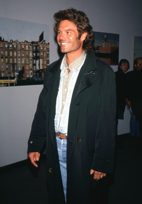Actor Harry Hamlin smiling, wearing a black overcoat at The Normal Heart AIDS Benefit at Criterion Center New York, April 16, 1993. Photo: Oscar Abolafia (harryhamlin002) Poster