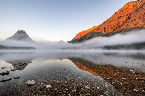 Foggy sunrise over Two Medicine Lake in Glacier National Park-Montana-USA Poster Print - Chuck Haney