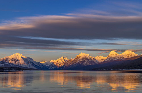 Winter sunset on mountain peaks over Lake McDonald in Glacier National Park-Montana-USA Poster Print - Chuck Haney