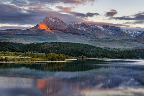 Mountain catches alpenglow light at sunset over St. Mary Lake-Glacier National Park-Montana-USA Poster Print - Chuck Haney