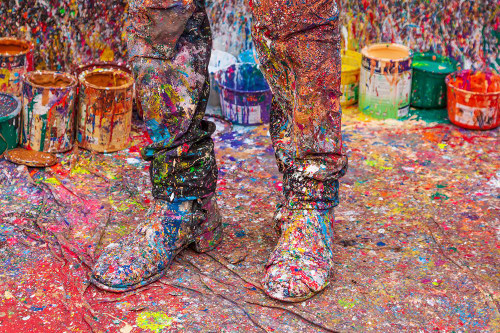 Argentina- Buenos Aires. Colorful paint spatters on artists boots. Poster Print - Tom Haseltine