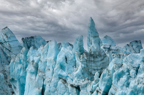 Rugged ice at the face of Margerie Glacier make it impossible to cross this terrain. Poster Print - Betty Sederquist