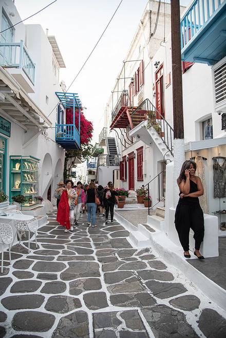In the streets of Mykonos Poster Print - Mona Singh