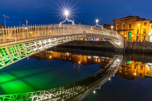 Ha Penny Bridge over the River Liffey at dusk in downtown Dublin-Ireland Poster Print - Chuck Haney
