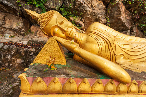Laos- Luang Prabang. Reclining Buddha statue on Mount Phousi. Poster Print - Tom Haseltine