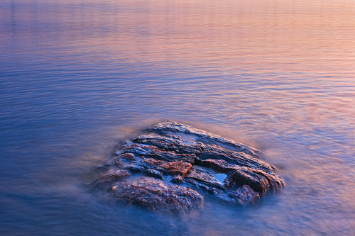 Canada- Manitoba- Paint Lake Provincial Park. Paint Lake. Exposed rock on Paint Lake at sunrise. Poster Print - Gallery Jaynes
