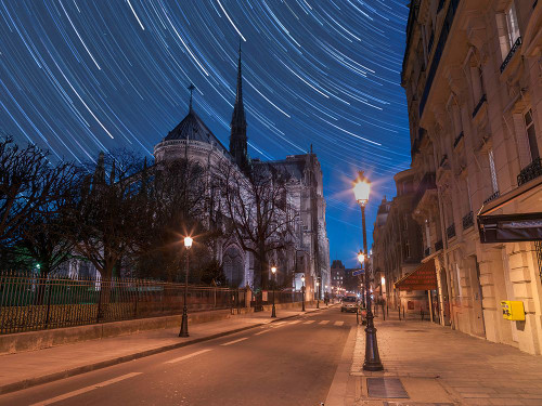 Star Trails above Notre-Dame de Paris Poster Print - Assaf Frank