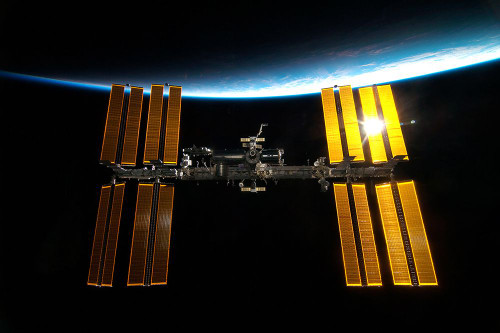 The International Space Station backdropped by Earth√ïs Horizon Poster Print - NASA