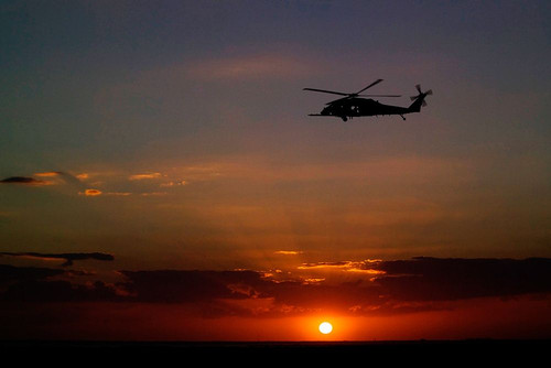 A Helicopter over the Kennedy Space Center Poster Print - NASA