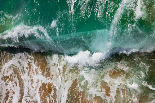 Wave Crashing on a Sandy Beach Poster Print - Artographie