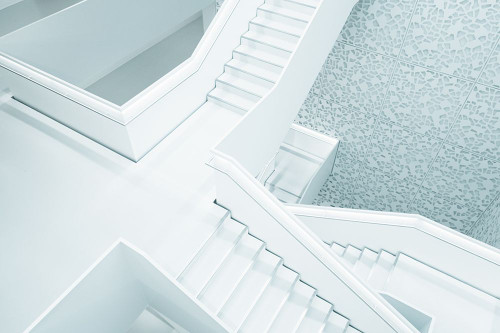 A Snow-White Stairway in a Building in Cologne Poster Print - Artographie