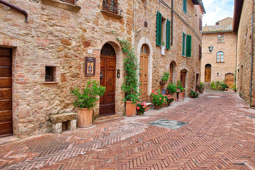 Italy-Tuscany-Pienza Flower pots and potted plants decorate a narrow street in a Tuscany village Poster Print - Julie Eggers # VARPDXEU16JEG1132