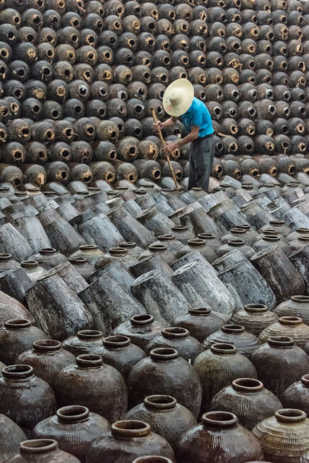 Man in the middle of big pile of wine jars-Wuxi-Jiangsu Province-China Poster Print - Keren Su # VARPDXAS07KSU3094