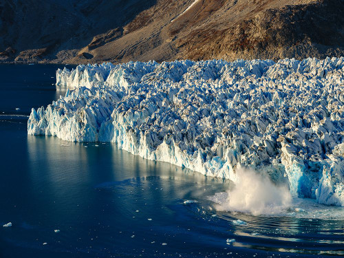 Ice calving. Knud Rasmussen Glacier-Sermiligaaq Fjord- Ammassalik- Danish Territory. Poster Print - Martin Zwick (24 x 18)