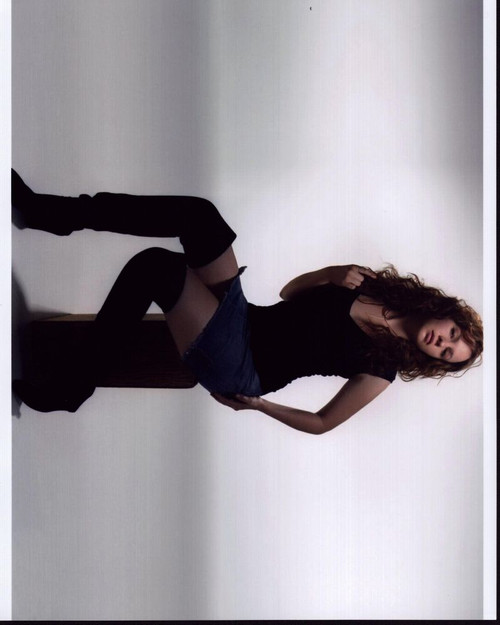 Amber Tamblyn Posed On Box In Skirt And High Boots Photo Print - Item # MVM56330