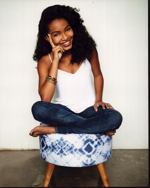 Yara Shahidi In Jeans On Stool Photo Print