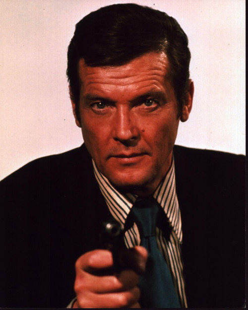 Roger Moore In Suit With Striped Shirt Pointing Gun Photo Print - Item # MVM55900