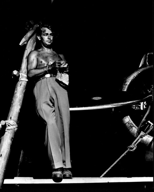 Alan Ladd Leaning On Post On Set Of Calcutta Black And White Photo Print - Item # MVM56256